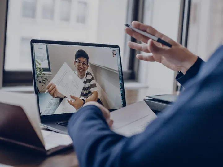 A sales executive on a video call with a prospective customer